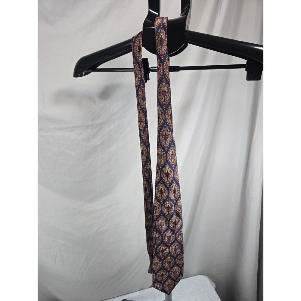 blue and burgundy silk neckties featuring a detailed medallion pattern with...